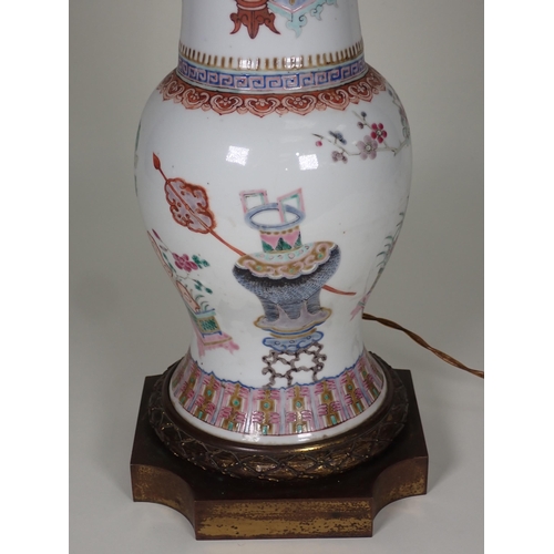 413 - A Chinese Vase with famille rose enamels, scenes of urns and flowers with decorative bands and ormol... 