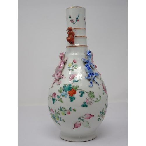 415 - A Chinese famille rose bottle Vase painted fruit and flowers with applied pair of pink and blue liza... 