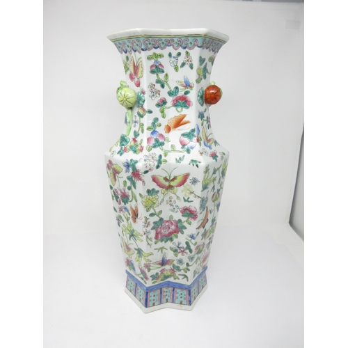 416 - A Chinese famille rose shaped octagonal tall Vase painted flowering shrubs and butterflies, moulded ... 