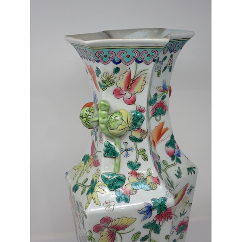 416 - A Chinese famille rose shaped octagonal tall Vase painted flowering shrubs and butterflies, moulded ... 