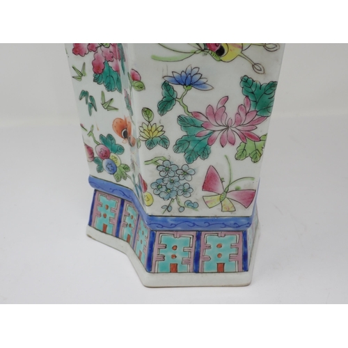 416 - A Chinese famille rose shaped octagonal tall Vase painted flowering shrubs and butterflies, moulded ... 