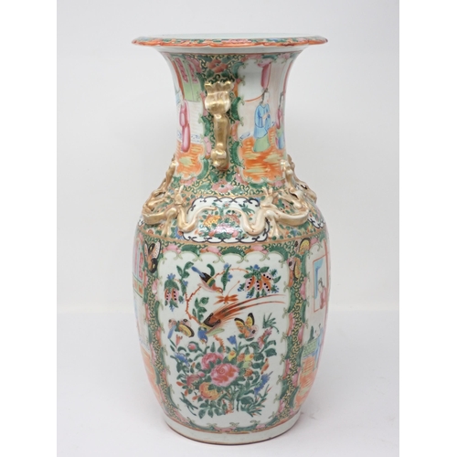 417 - A 19th Century Cantonese baluster Vase with Dog of Fo handles and relief moulded dragons above panel... 