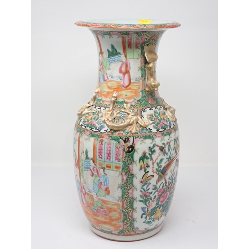 417 - A 19th Century Cantonese baluster Vase with Dog of Fo handles and relief moulded dragons above panel... 