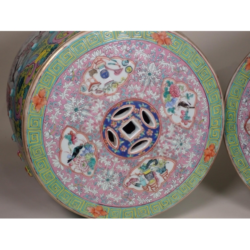 418 - A pair of 19th Century Chinese polychrome Garden Seats, the pierced tops decorated panels of birds a... 