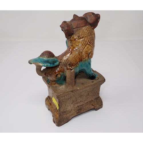 419 - A Chinese pottery Dog of Fo and ball on plinth, 7in high A/F, a small ceramic recumbent Dog of Fo, 3... 