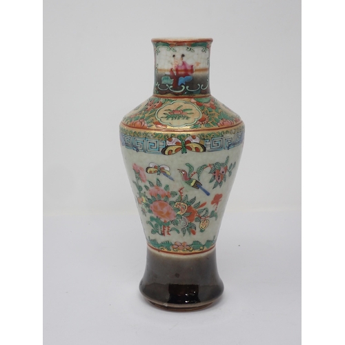 420 - A Chinese famille rose Vase of baluster form and decorated panels of figures and flowers, 9in H