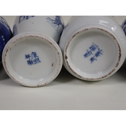 425 - A collection of 19th Century Chinese blue and white Vases, including a pair with panels of vases, 7½... 