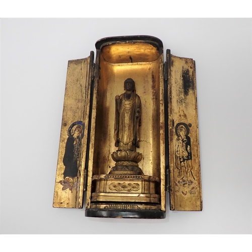 427 - A portable Shrine having laquered finish, two doors open to reveal gilded wooden Buddha on lotus flo... 