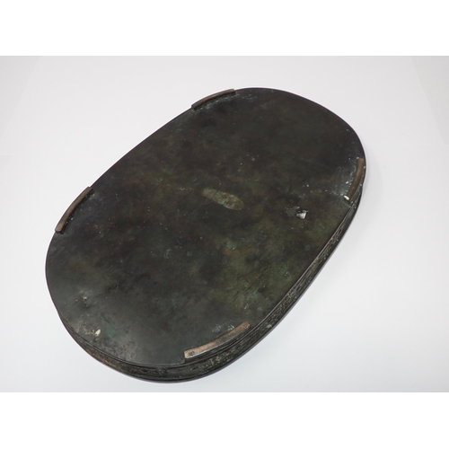 428 - A Chinese shallow metal oval Dish, possibly for narcissus bulbs, outer side embossed good luck symbo... 