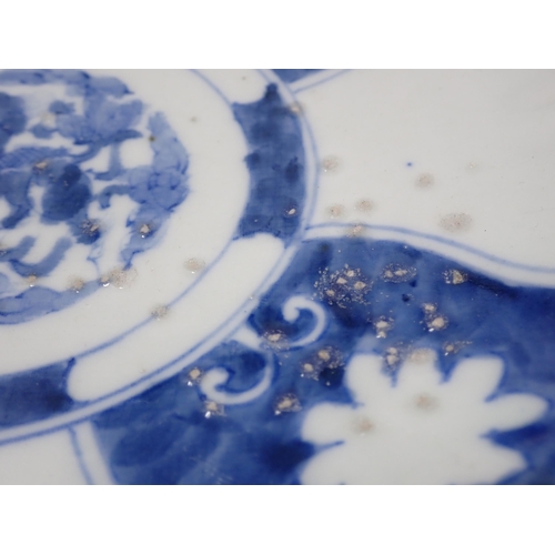 431 - A set of three Chinese blue and white Dishes decorated alternating panels with dragons to the centre... 