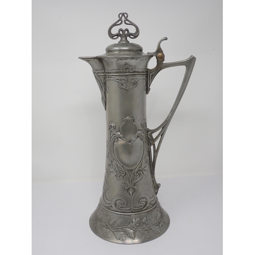 440 - A large WMF Art Nouveau Ewer with hinged cover and spreading base, with design of Art Nouveau motifs... 