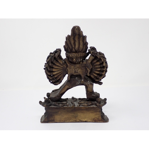 441 - An Indian bronze erotic Figure Group, the horned figure with multiple arms and legs, 8 1/2in H