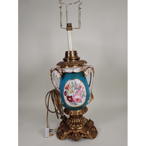 447 - A large porcelain and gilt metal two-handled Table Lamp decorated oval panels with lovers in a lands... 