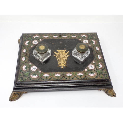 449 - A Victorian ebonised and enamel Inkstand with two inset glass inkwells, the brass covers stamped 'Pa... 