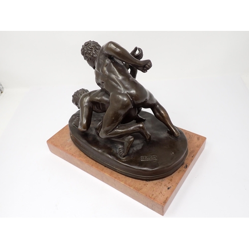 454 - After Tupton, a 20th Century bronze copy of 'The Wrestlers', depicting two nude males, on rectangula... 