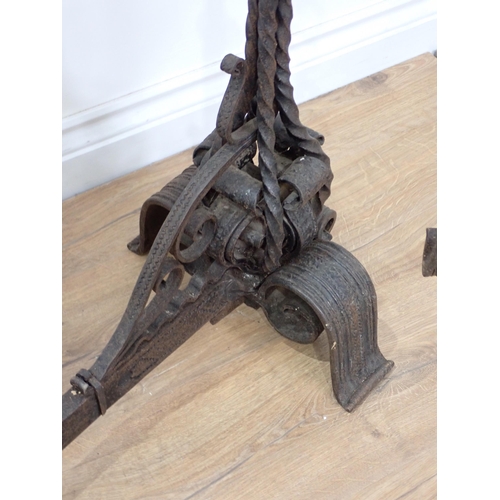 456 - An antique wrought iron central Fire Hearth Crane in the  16th Century style with pair of upright ca... 