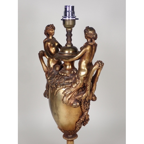 460 - A bronze two handled Table Lamp with figures holding bowl, the handles with leafage, rope twist and ... 