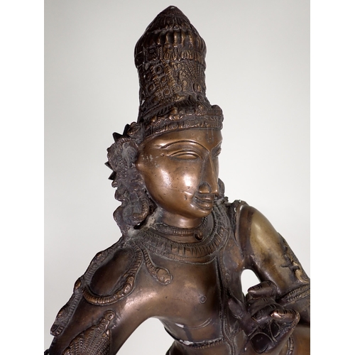 473 - A large bronze Eastern Figure, possibly Krishna, on a square base, 2ft 7in H