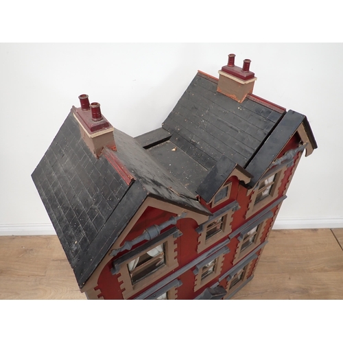 483 - An Art Nouveau Doll's House with unusual triple gable roof, the front opening in two sections to rev... 