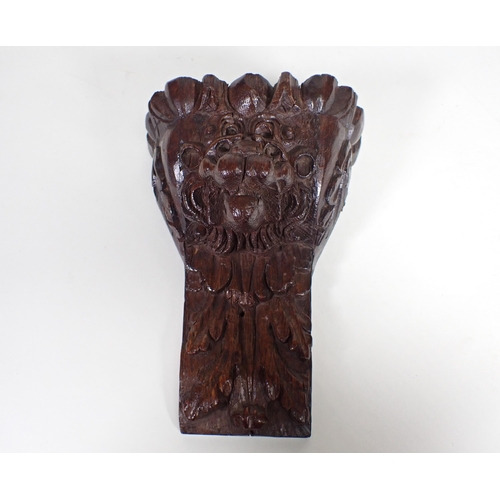 498 - A 19th Century pine Panel carved leaves and berries 1ft 9in x 6in, an oak Carving of cherub astride ... 