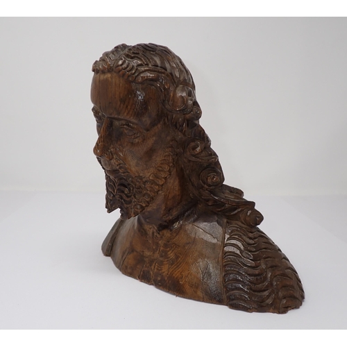 499 - A finely carved wooden Bust, possibly of John the Baptist, with fleece over right shoulder, possibly... 