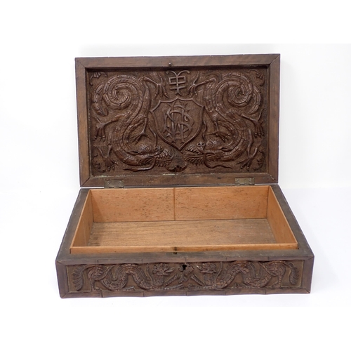 500 - A Kashmir carved Box, the hinged cover with relief carved motif for the Royal Artillery, surrounded ... 