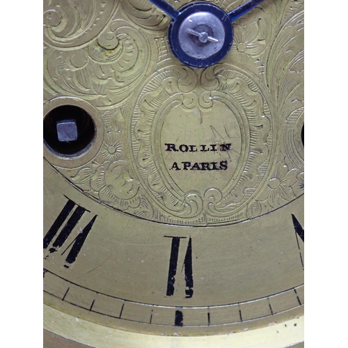 504 - A black marble Mantel Clock with engraved circular brass dial, inscribed Rollin A Paris, striking on... 