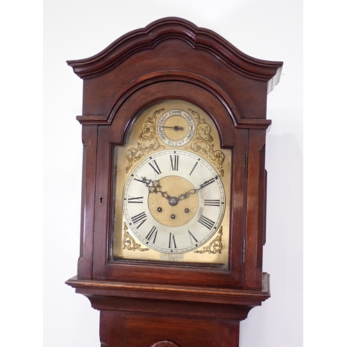 505 - An inlaid mahogany Longcase Clock with arched brass dial, silvered chapter ring, the back of the mov... 