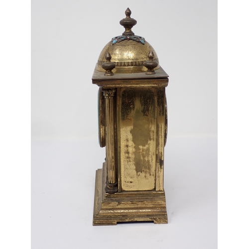 509 - A brass Mantel Timepiece, the domed top with enamel decoration, circular dial (A/F), above an enamel... 