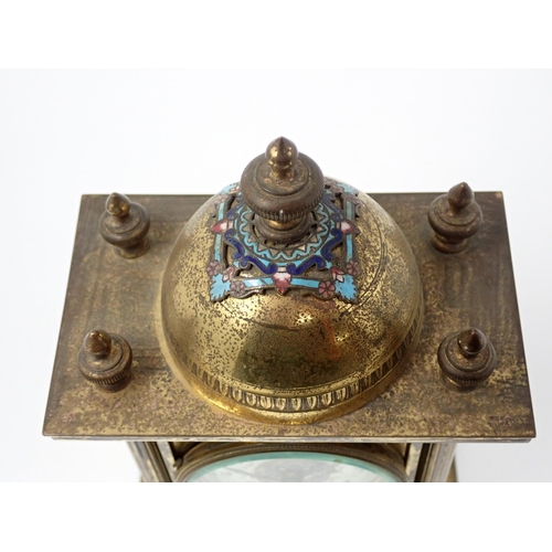 509 - A brass Mantel Timepiece, the domed top with enamel decoration, circular dial (A/F), above an enamel... 