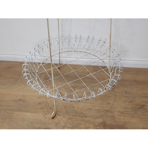 534 - A Victorian white painted wirework three tier circular Plant Stand 5ft 5in H x 2ft 7in D