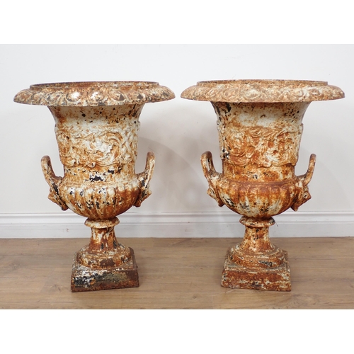 537 - A pair of white painted cast iron Campana Garden Urns in the manner of Handyside, with egg and dart ... 