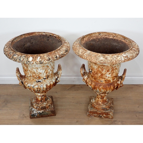 537 - A pair of white painted cast iron Campana Garden Urns in the manner of Handyside, with egg and dart ... 