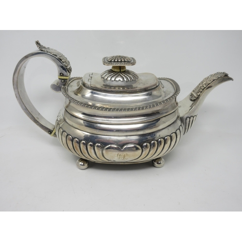 56 - A George IV silver three-piece Tea Service of boat shape with gadroon embossing and rims, on ball fe... 