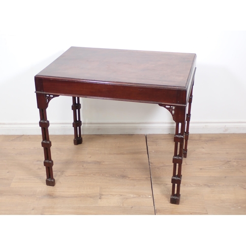 561 - A George III style mahogany Silver Table with pierced fret brackets and mounted upon cluster support... 