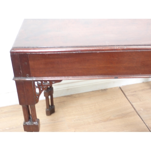 561 - A George III style mahogany Silver Table with pierced fret brackets and mounted upon cluster support... 