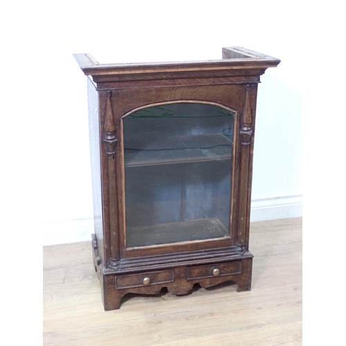 563 - A 19th Century Welsh oak Cabinet fitted single glazed door between moulded half pilasters above sing... 