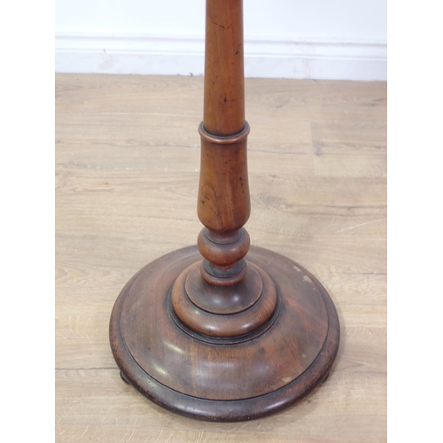 566 - A 19th Century mahogany circular Plant Stand on turned column, circular base and spherical feet 2ft ... 