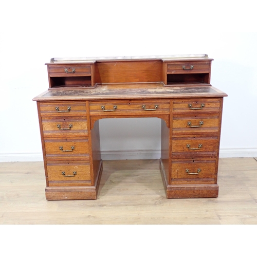 567 - A Victorian walnut Kneehole Desk by Gillows & Co. fitted two drawers to raised back above two banks ... 