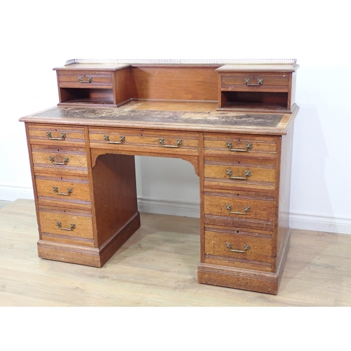 567 - A Victorian walnut Kneehole Desk by Gillows & Co. fitted two drawers to raised back above two banks ... 