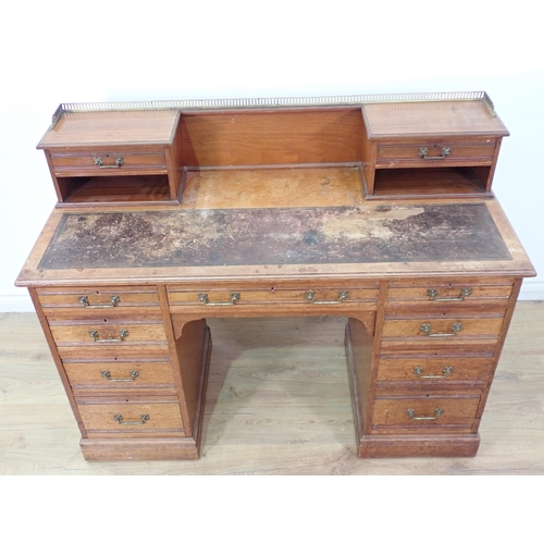 567 - A Victorian walnut Kneehole Desk by Gillows & Co. fitted two drawers to raised back above two banks ... 