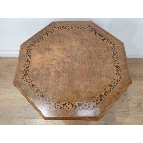 577 - A Victorian octagonal walnut Occasional Table, the top with ebonised scrolled band, stringing to the... 