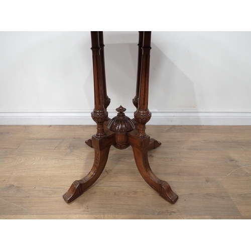 577 - A Victorian octagonal walnut Occasional Table, the top with ebonised scrolled band, stringing to the... 