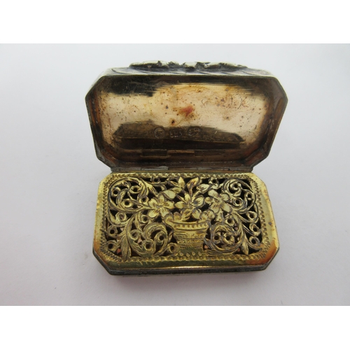 59 - A Victorian silver Vinaigrette of oblong form with chamfered corners, leafage scroll engraved, the g... 