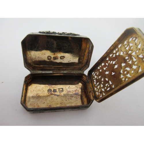 59 - A Victorian silver Vinaigrette of oblong form with chamfered corners, leafage scroll engraved, the g... 