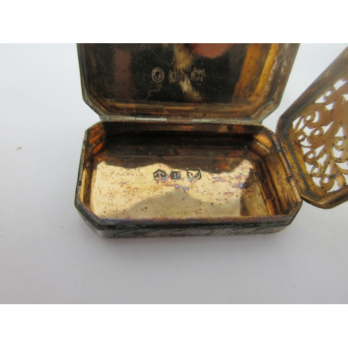 59 - A Victorian silver Vinaigrette of oblong form with chamfered corners, leafage scroll engraved, the g... 