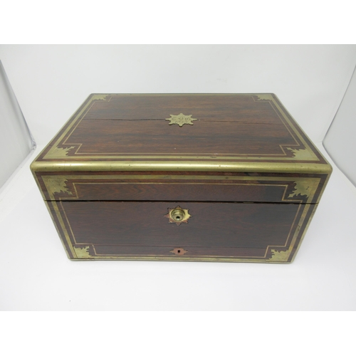 6 - An early Victorian rosewood Dressing Case with brass inlay, the interior with numerous silver lidded... 