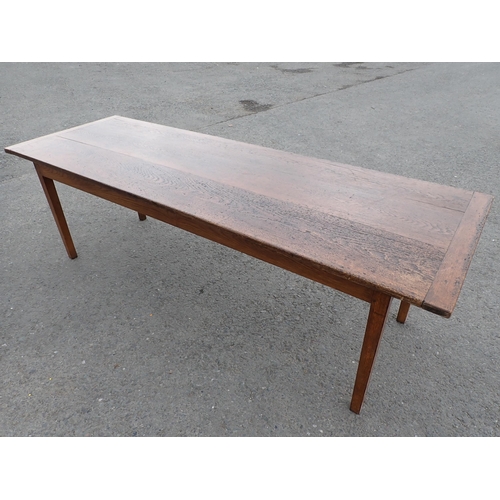 608 - An oak Farmhouse Table, the cleated 3-board top raised on square tapered legs, 7ft 4in L, 2ft 8in W