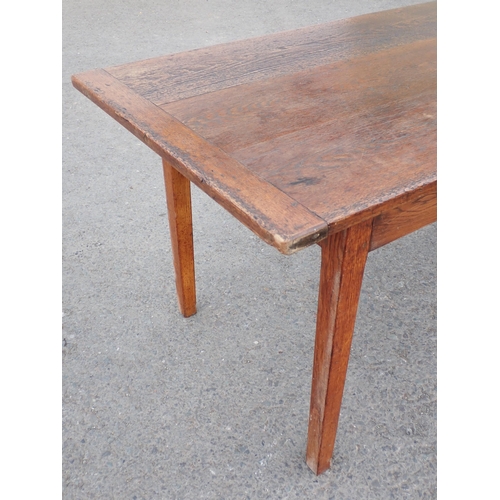 608 - An oak Farmhouse Table, the cleated 3-board top raised on square tapered legs, 7ft 4in L, 2ft 8in W