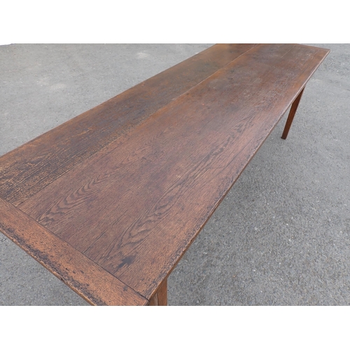 608 - An oak Farmhouse Table, the cleated 3-board top raised on square tapered legs, 7ft 4in L, 2ft 8in W